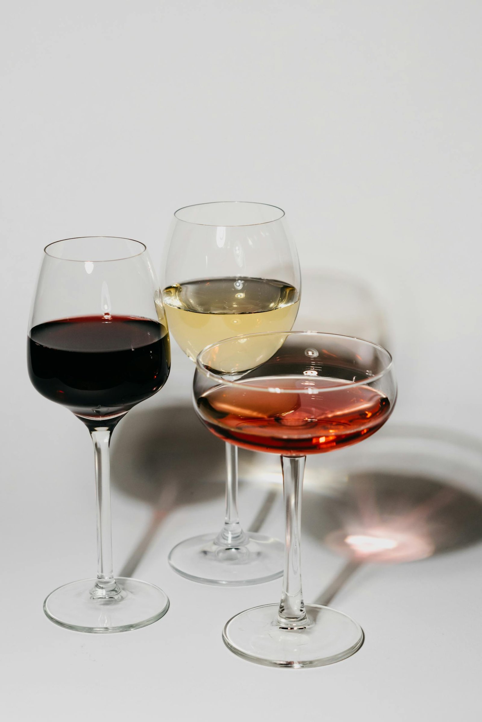 Elegant presentation of red, white, and rosé wines in stylish glassware for a sophisticated setting.